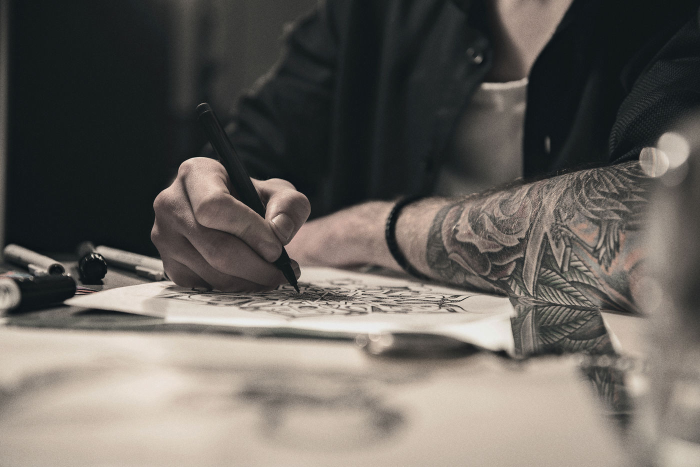 Björn hand-drawing a custom tattoo design