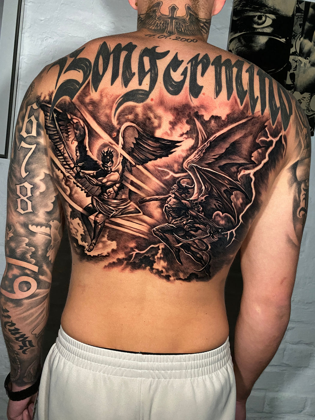 Detailed black and grey realism back piece by Oxygen Ink Marbella